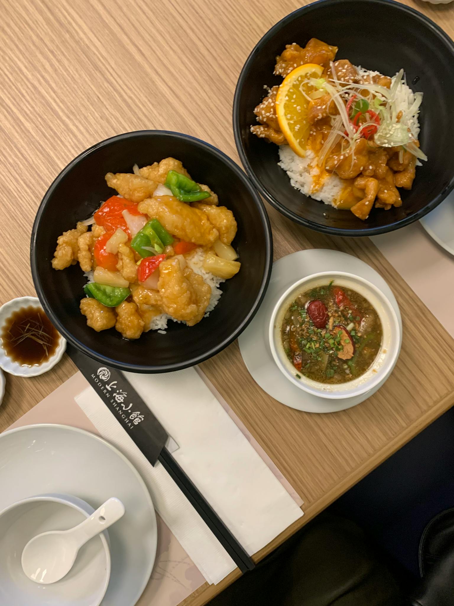 Flat lay of tasty Chinese chicken dishes with rice, perfect for food enthusiasts and restaurant promotions.