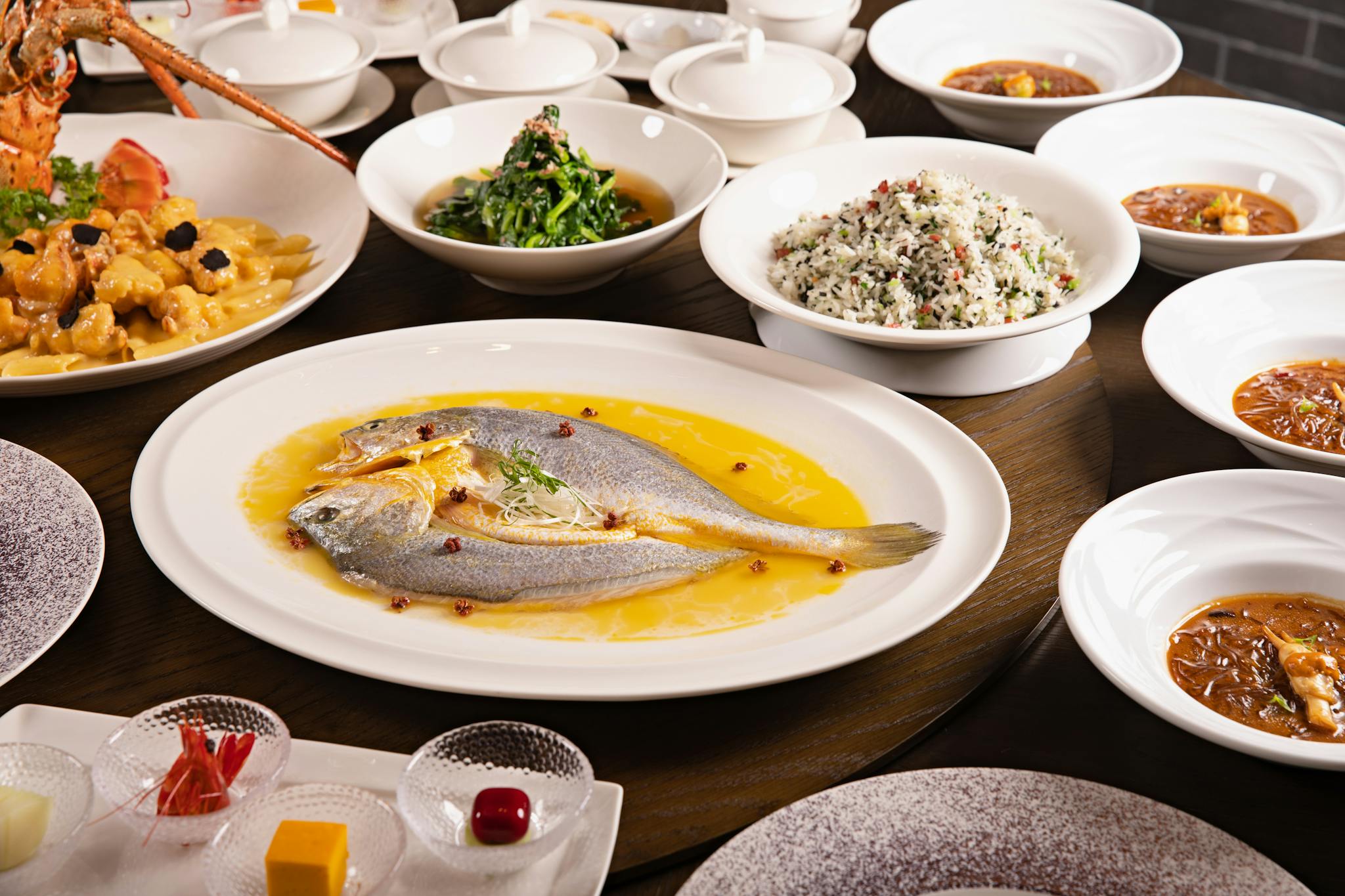 Luxurious Asian seafood banquet with a variety of dishes elegantly presented on a dining table.